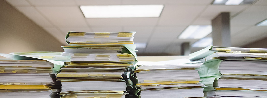 stacks of files under halogen lighting