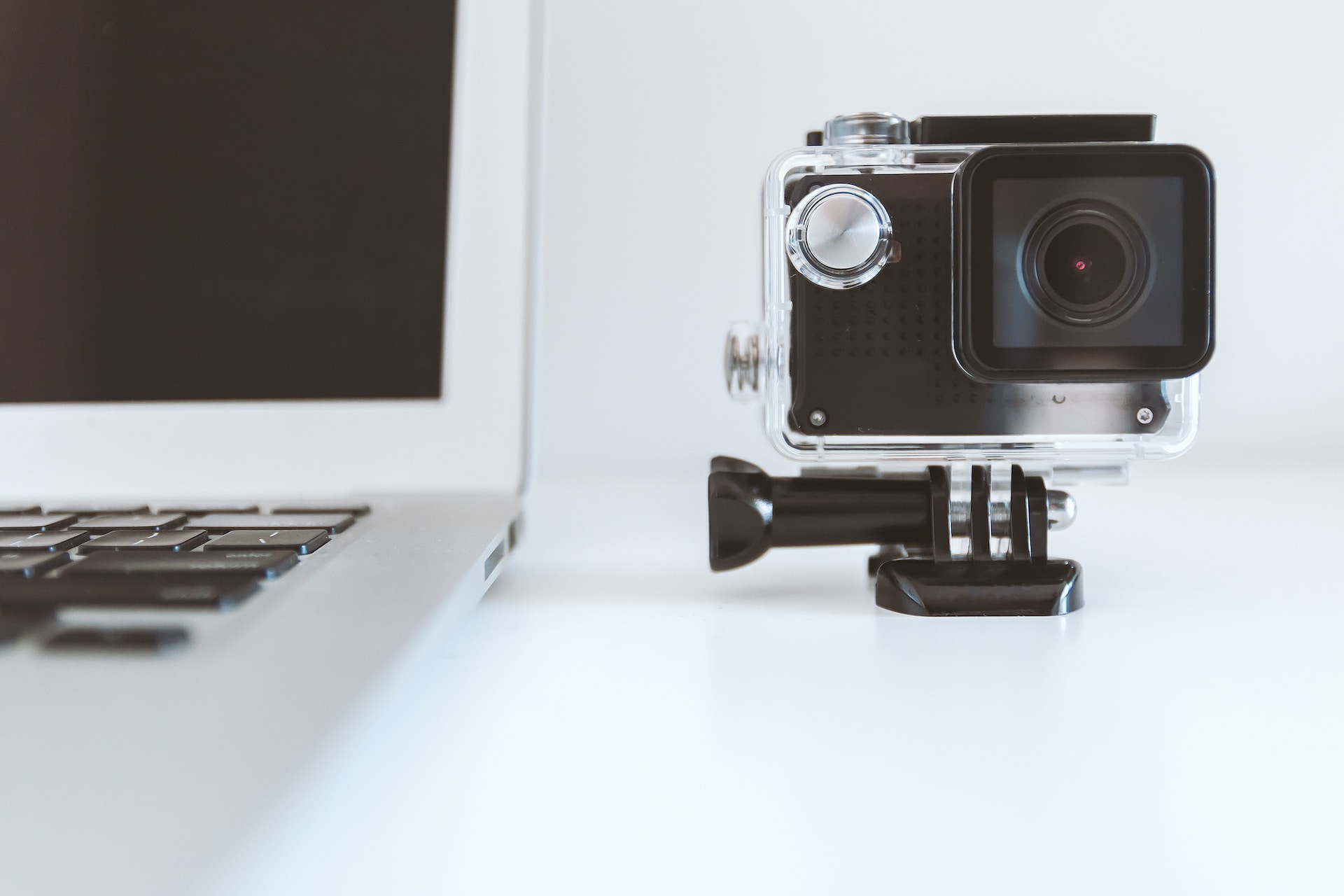 Camera placed next to a laptop